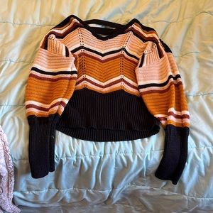 Knitted sweater with open back and puffy sleeves